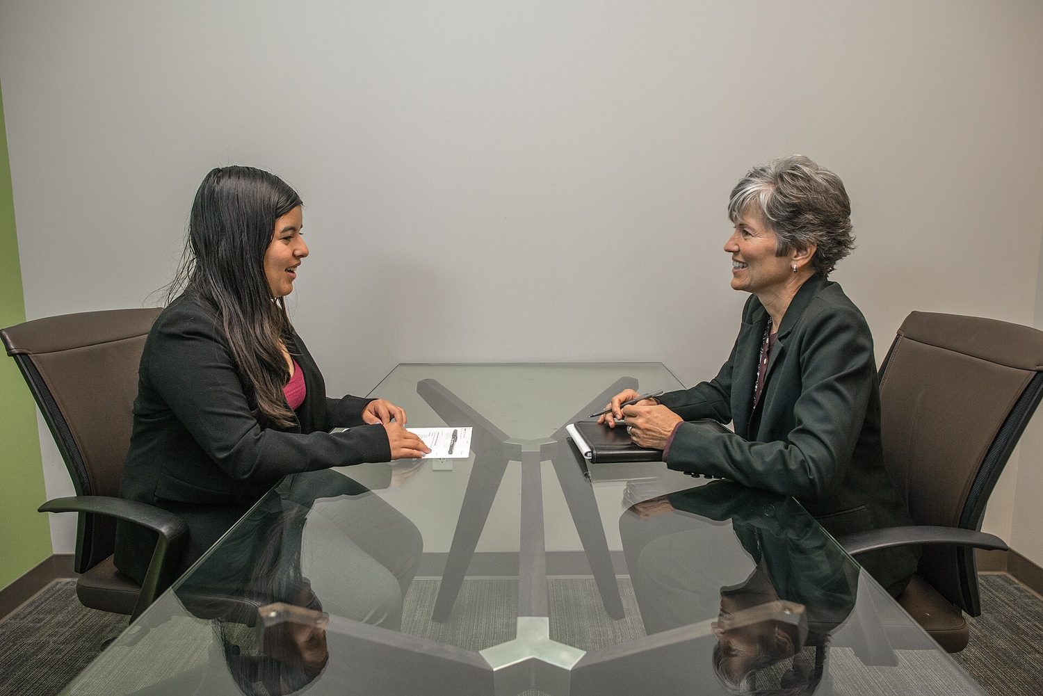 A young woman answering questions in a job interview