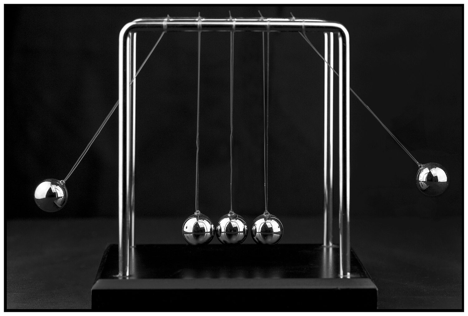 A Newton's cradle with five steel balls