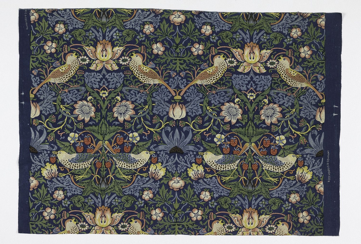 William Morris's Strawberry Thief: one motif of birds among strawberries repeats in a regular pattern across the whole cloth
