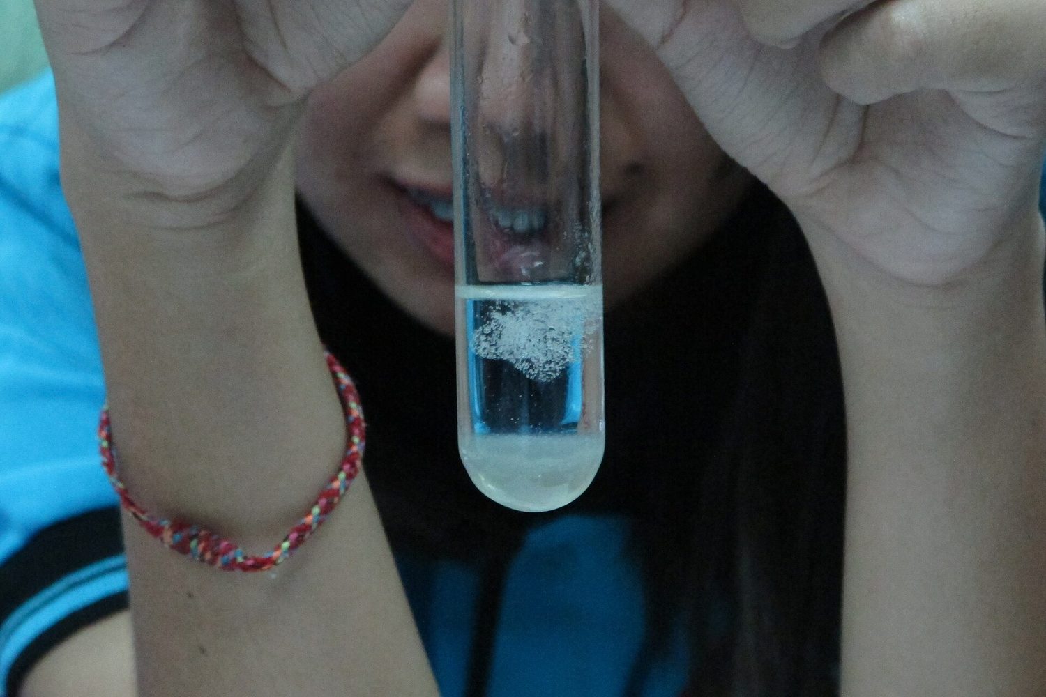 Spooling precipitated DNA from a cell extract — DNA is a real, visible molecule