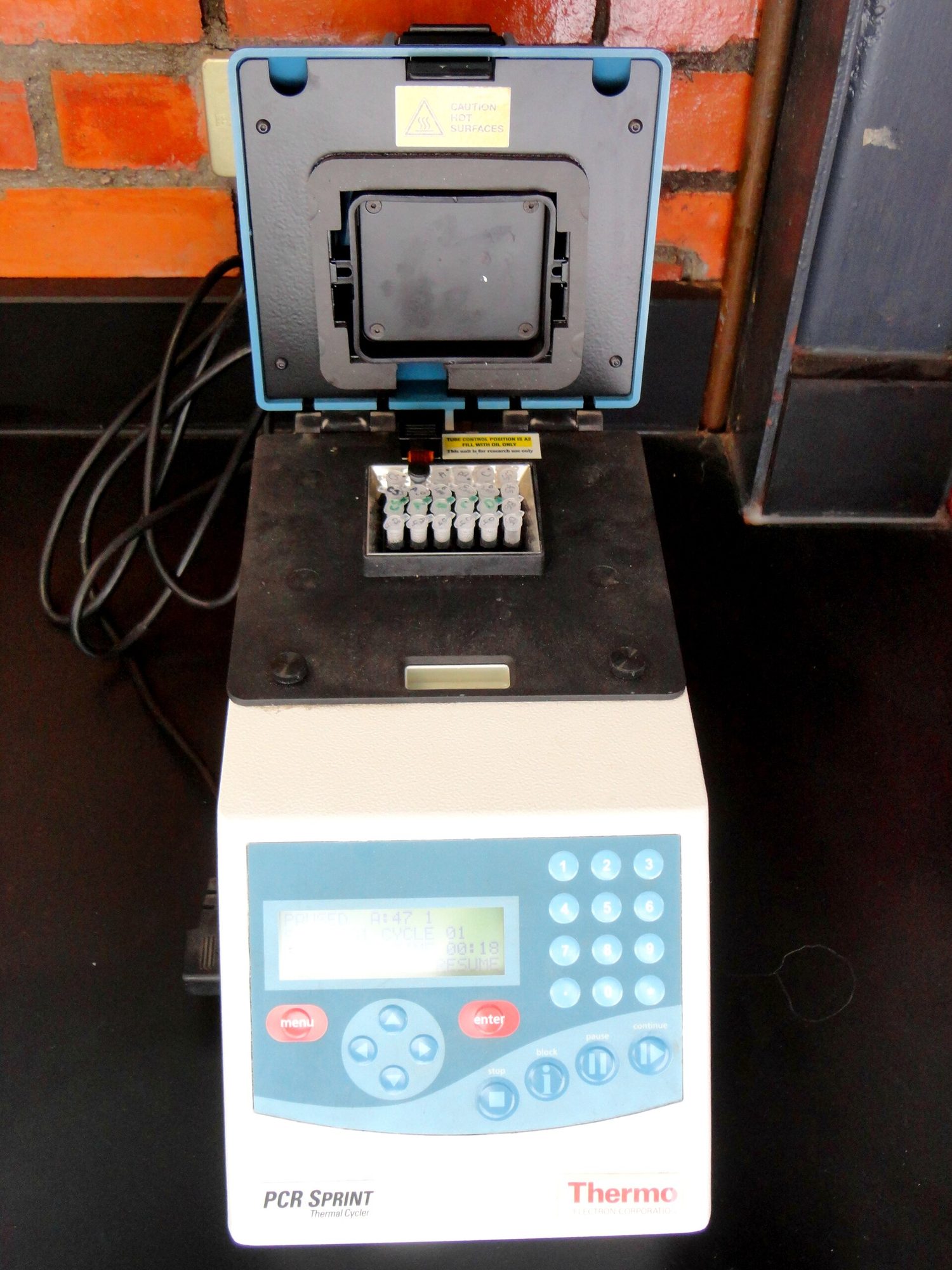 A thermal cycler repeatedly heats and cools samples to amplify DNA (PCR)