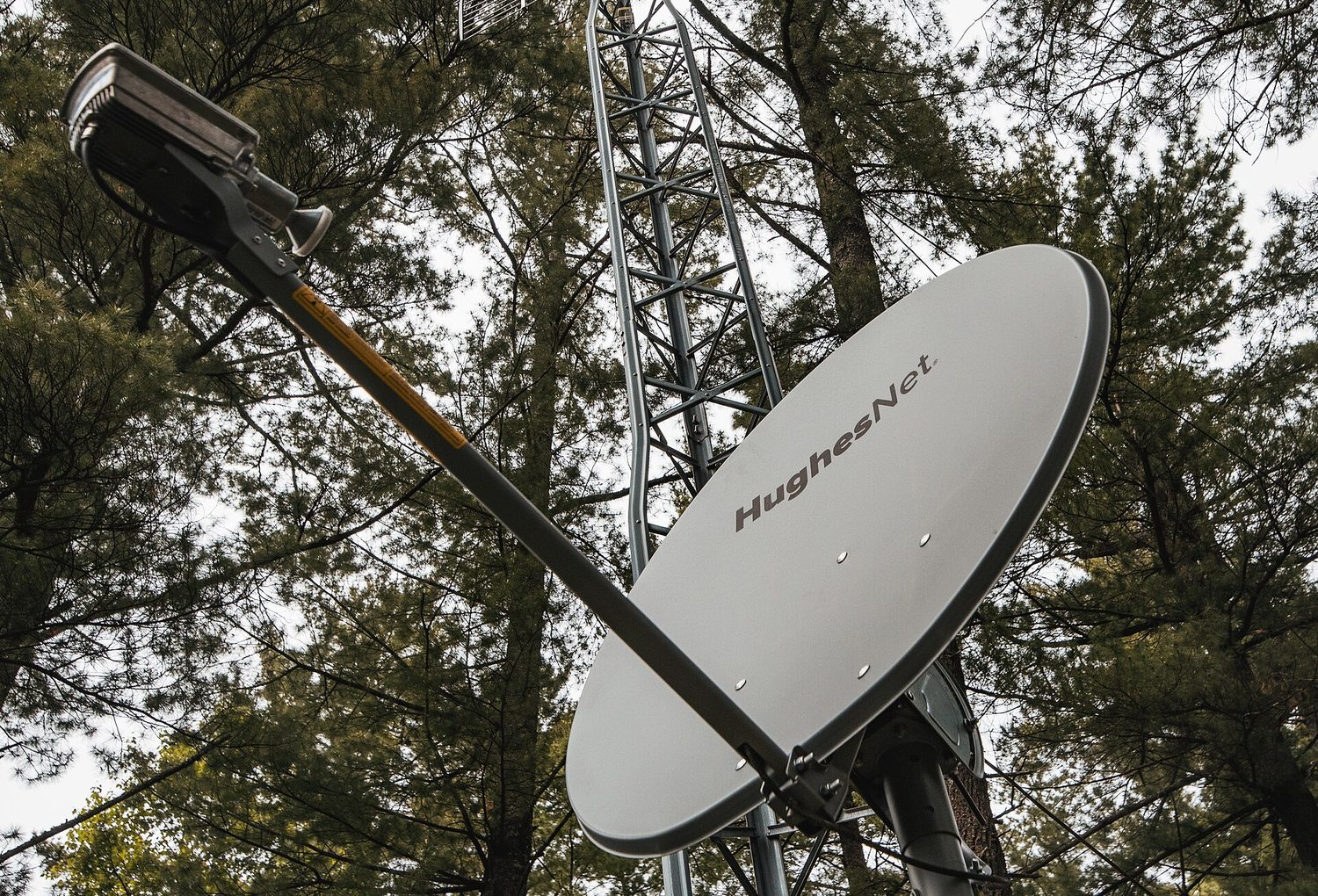 A rural satellite dish: geography still shapes who gets fast internet and who waits