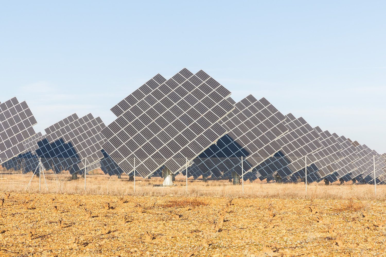 A solar farm: generating more renewable energy and cutting demand are both energy-conservation strategies