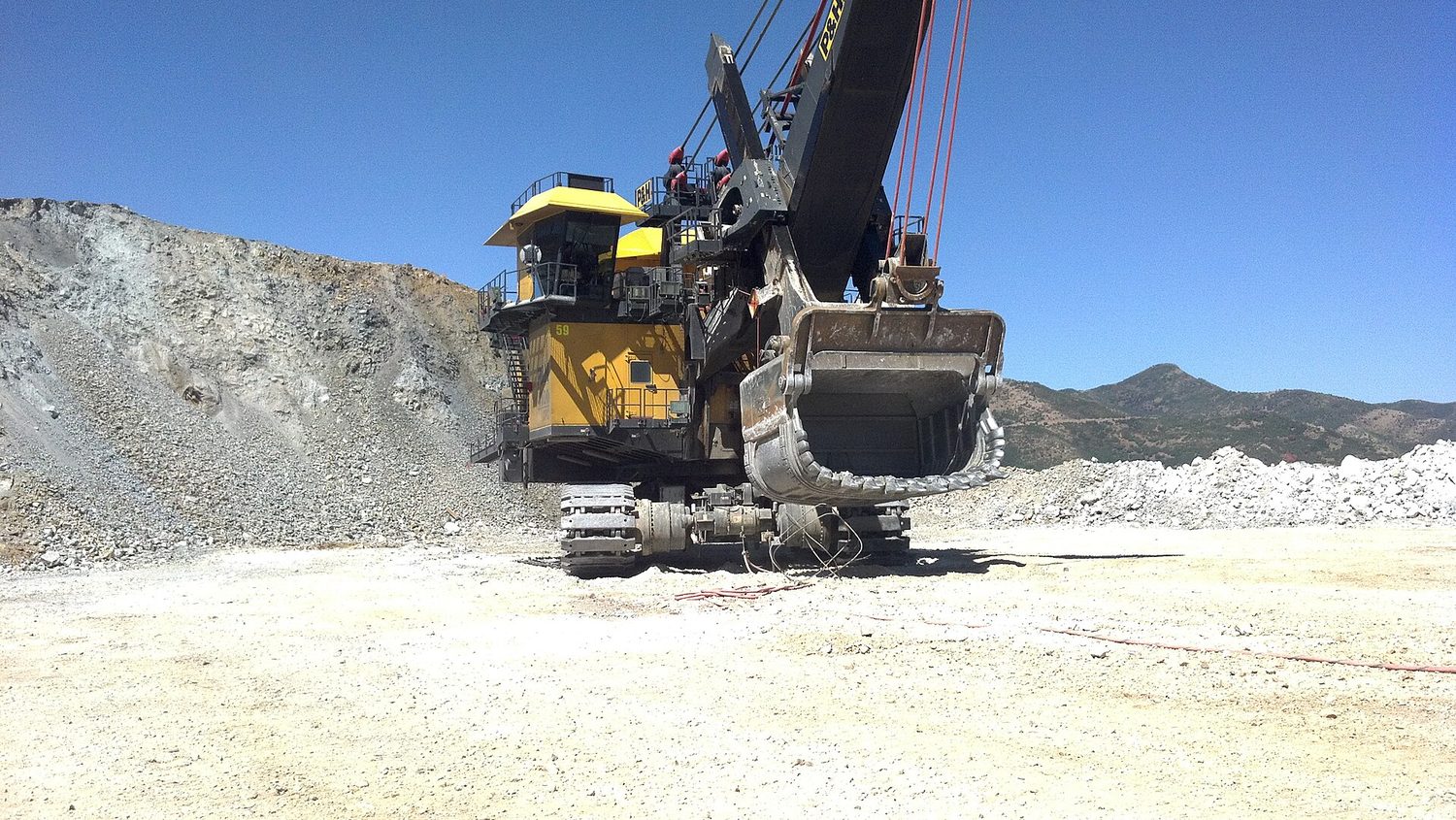 An open-pit mine: land and minerals are scarce resources with opportunity cost