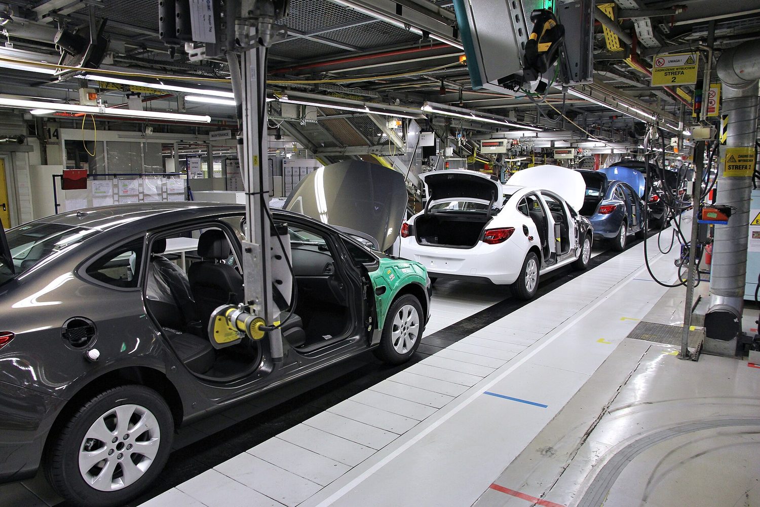 A car assembly line: market power and firm scale differ under imperfect competition