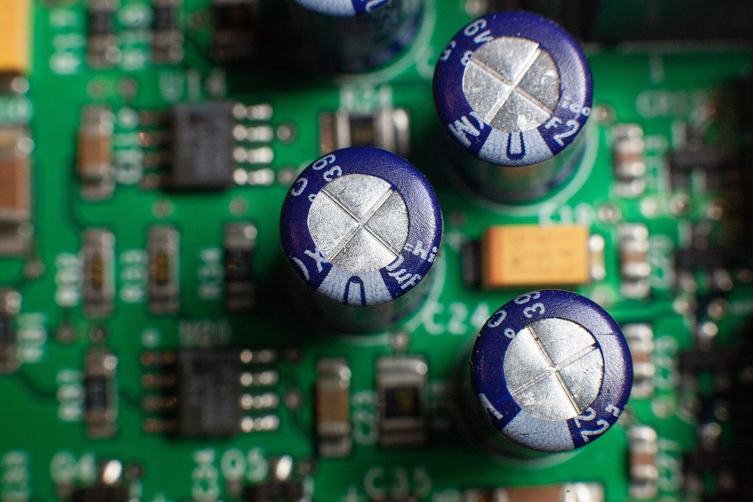 Electrolytic capacitors on a circuit board: capacitance stores energy as U = ½CV²