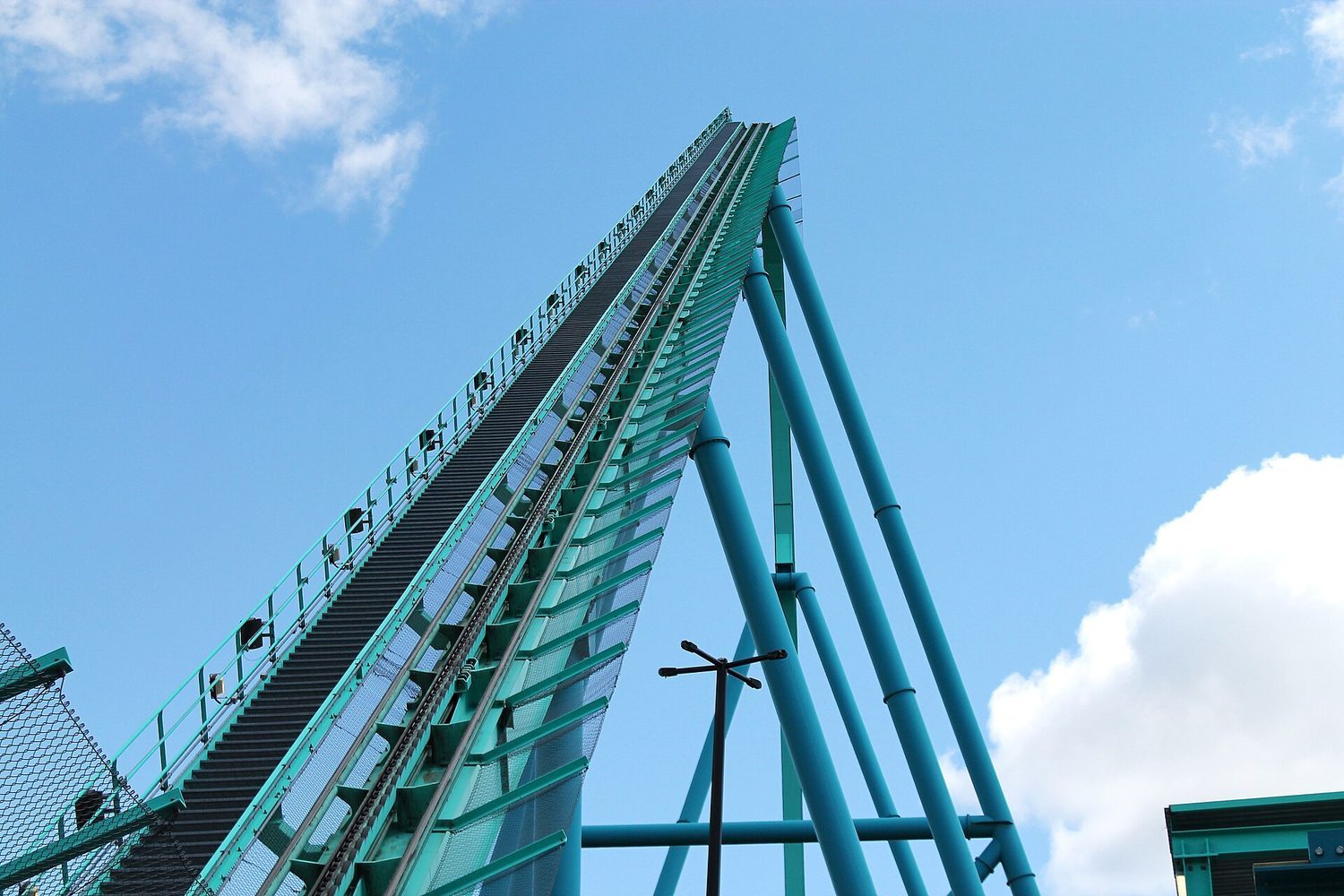A roller coaster trades energy back and forth: highest (most PE) at the top, fastest (most KE) at the bottom