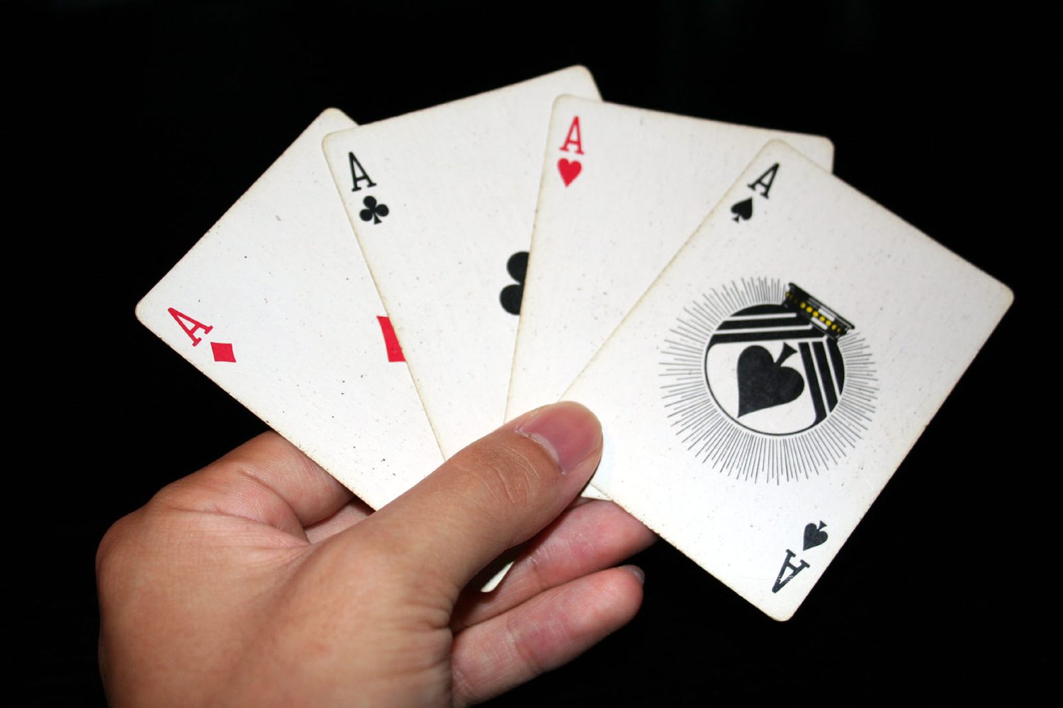The four aces from a deck of playing cards