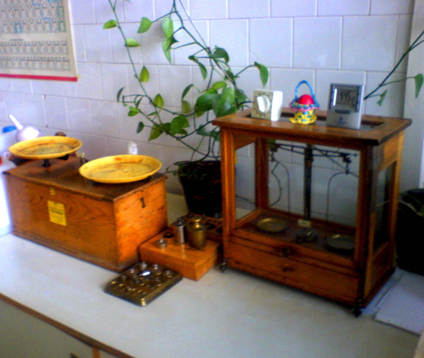 A laboratory balance measures mass, the basis of mole calculations