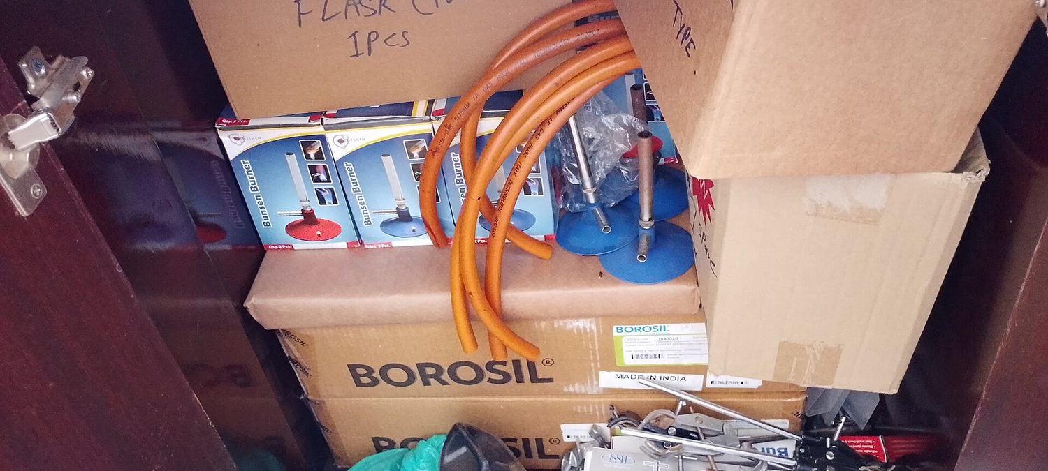 A Bunsen burner with a blue flame