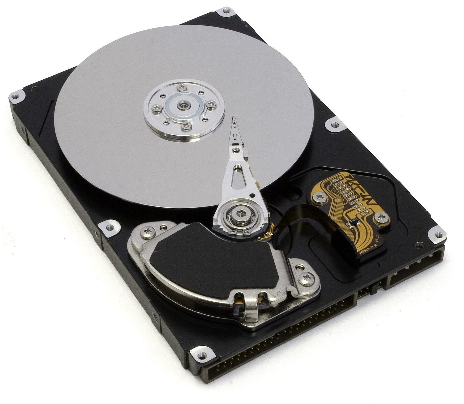 Inside a hard disk drive (HDD): the shiny disk spins and the arm reads the magnetised data