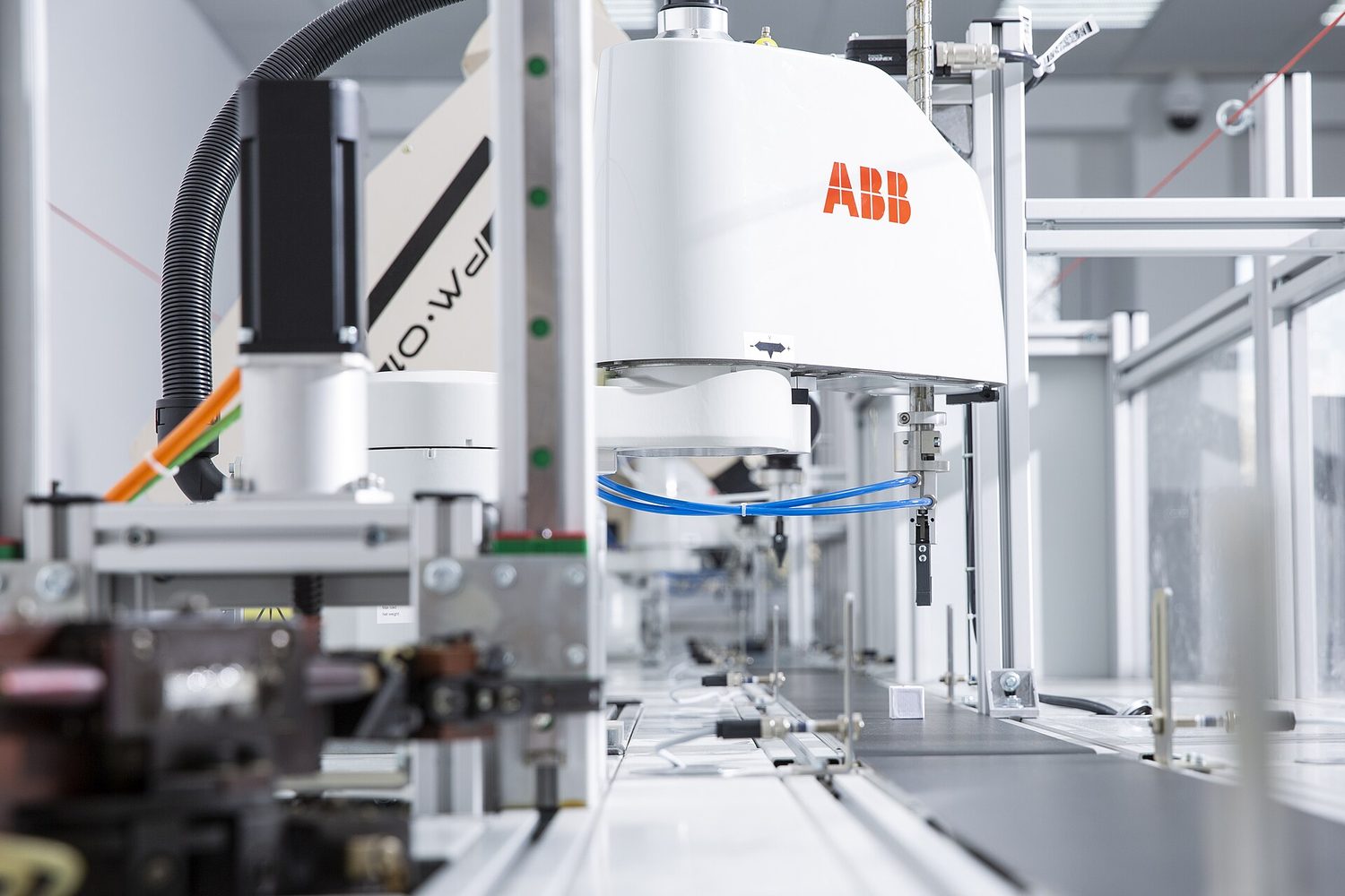 An industrial robot arm. It follows a program and can be reprogrammed to do a new job.