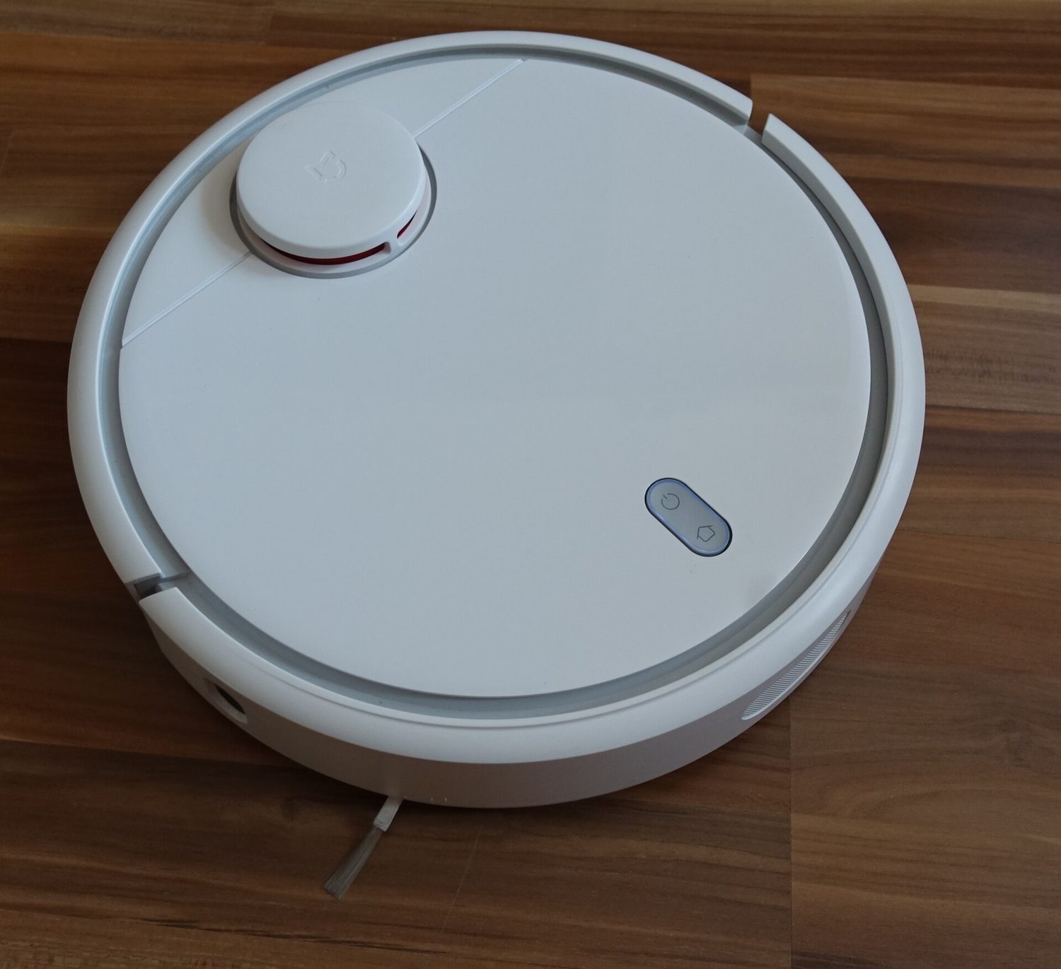 A robot vacuum cleaner: a home robot that drives itself around to clean the floor