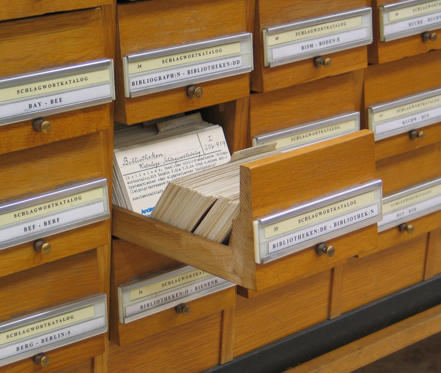 A library card catalogue is a database on paper — records you can search by index.