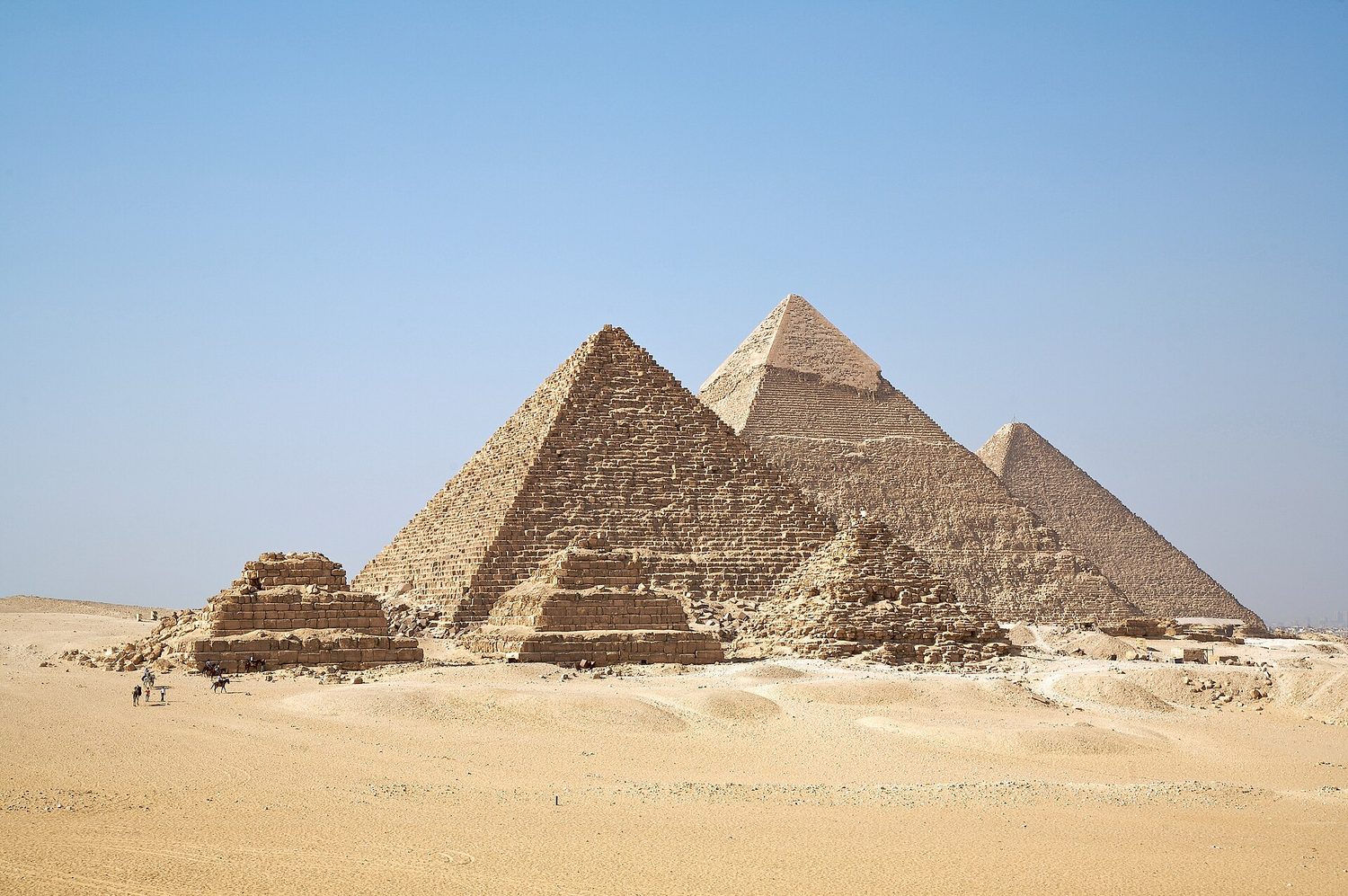 The pyramids of Giza are giant square-based pyramids — real solids whose volume and surface area you can calculate