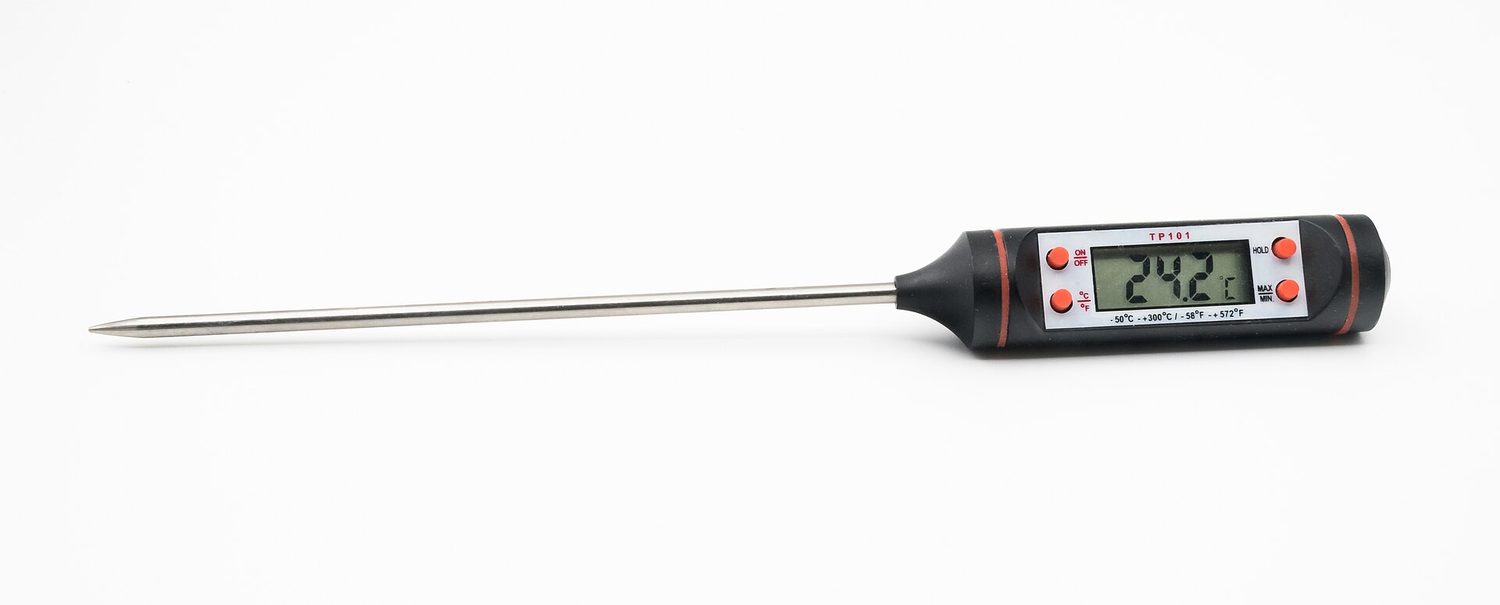 A digital thermometer measures temperature